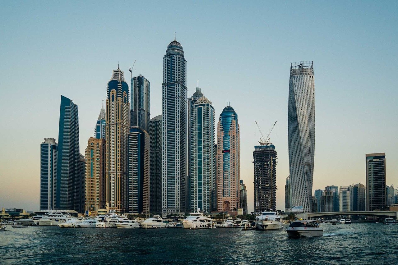 Skyscrapers with a row of yachts lining in Dubai Marina 
