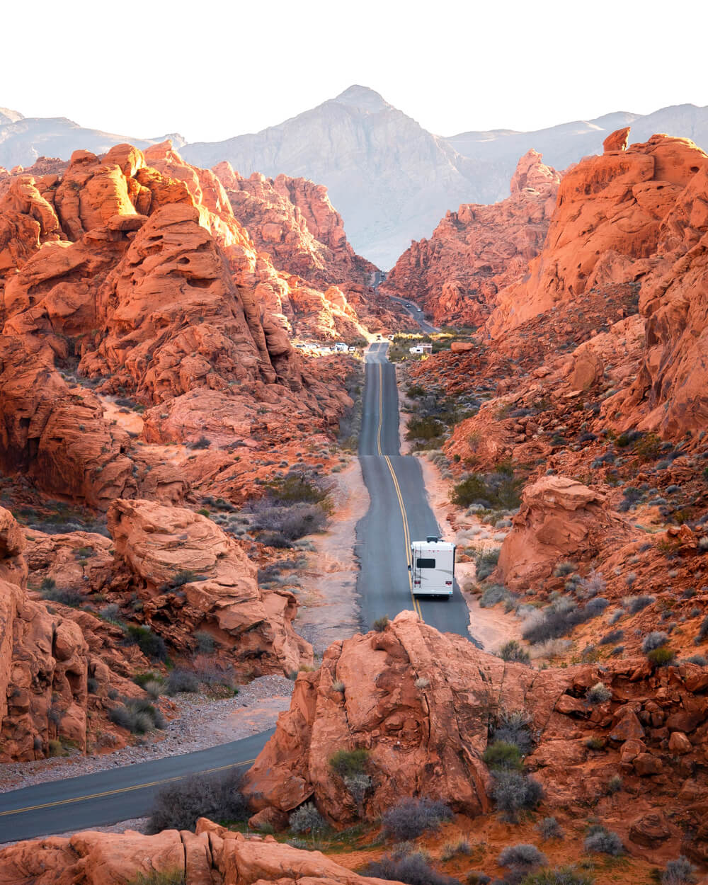 An RV driving down a road in Death Valley National Park