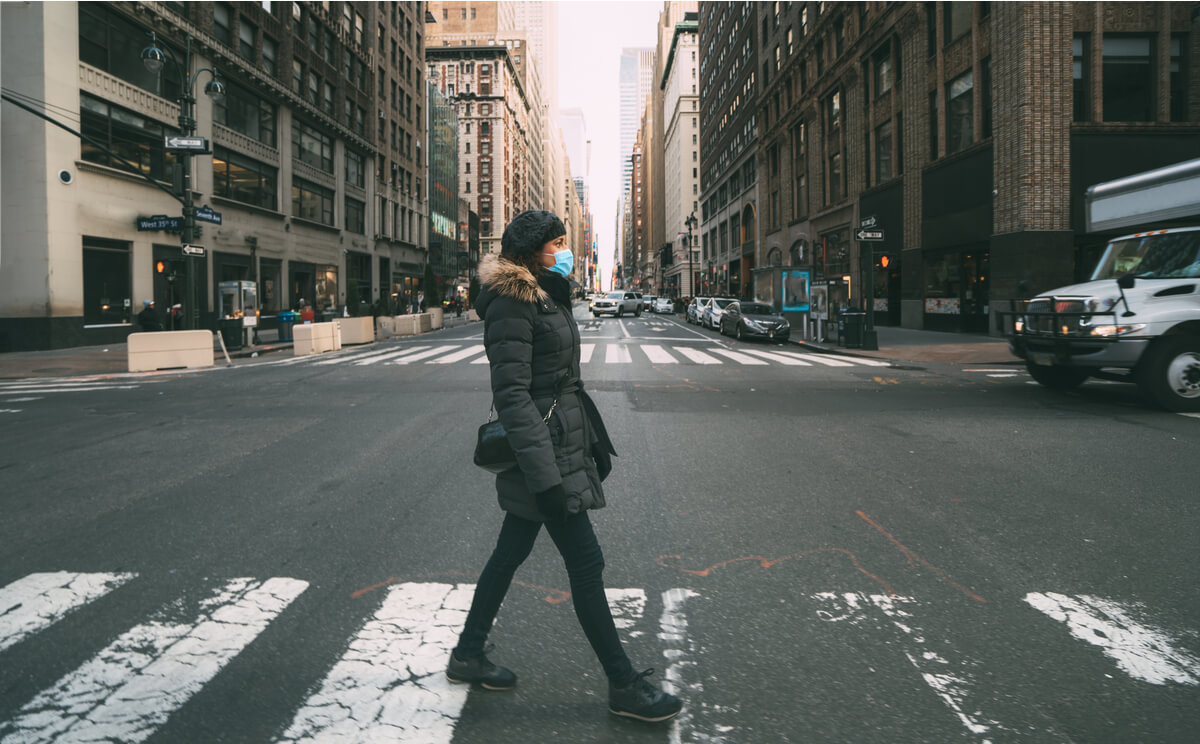 Solo travelling American tourist crossing the street