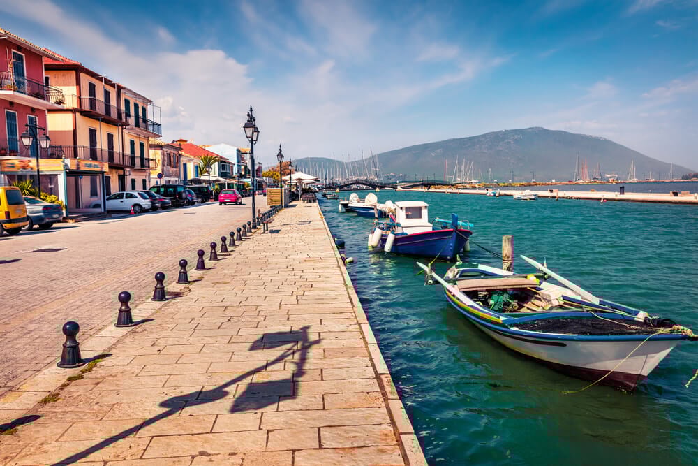 view of the sidewalk and ocean in Lefkada Town
