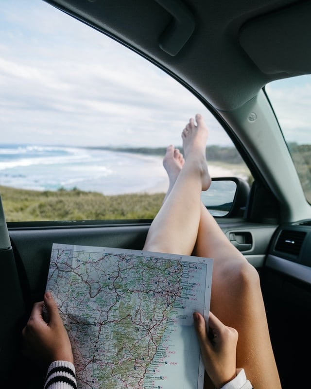 A woman with a map plans an RV trip