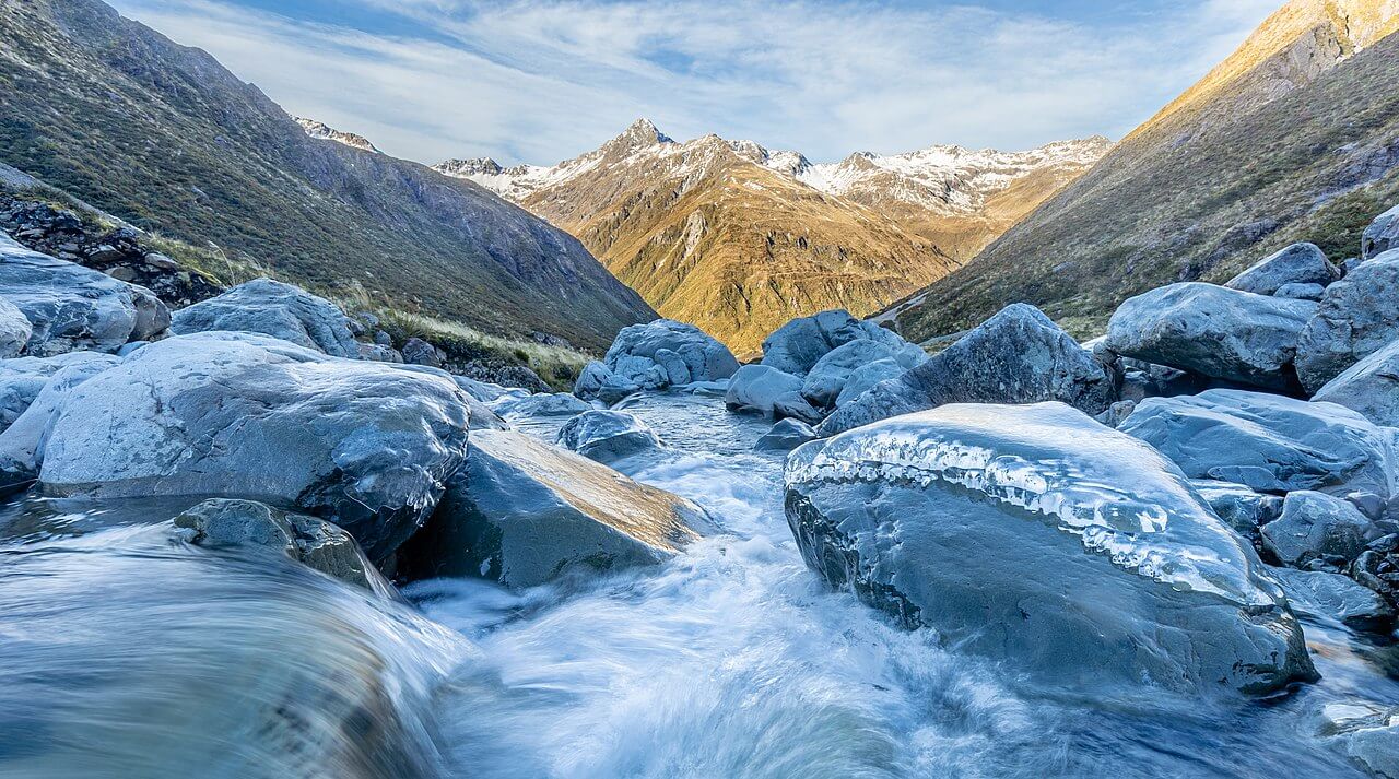 Surging river in a valley photographed hiking in Arthur's Pass