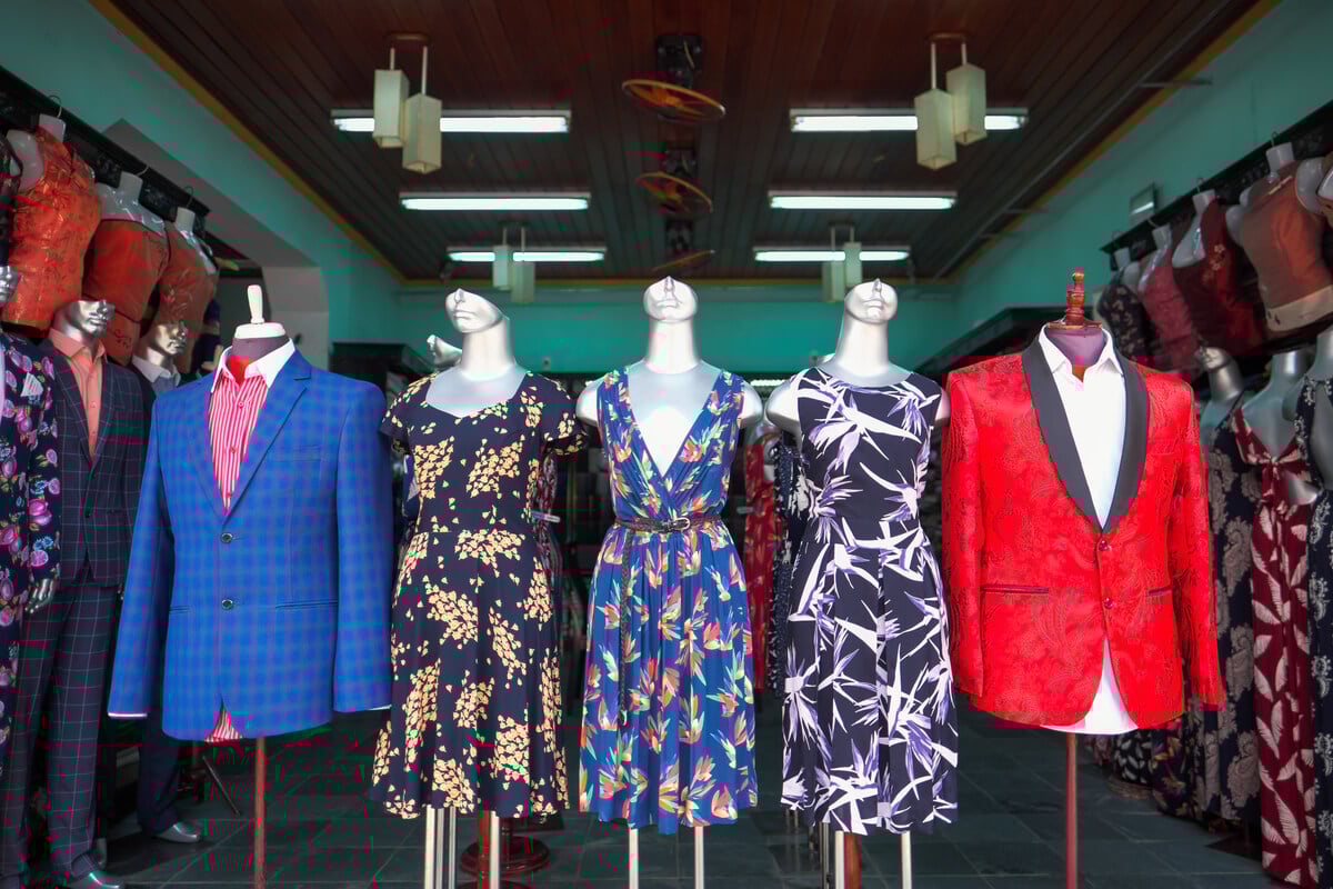 Tailor-made silk suits and blouses in a clothes shop in Hoi An