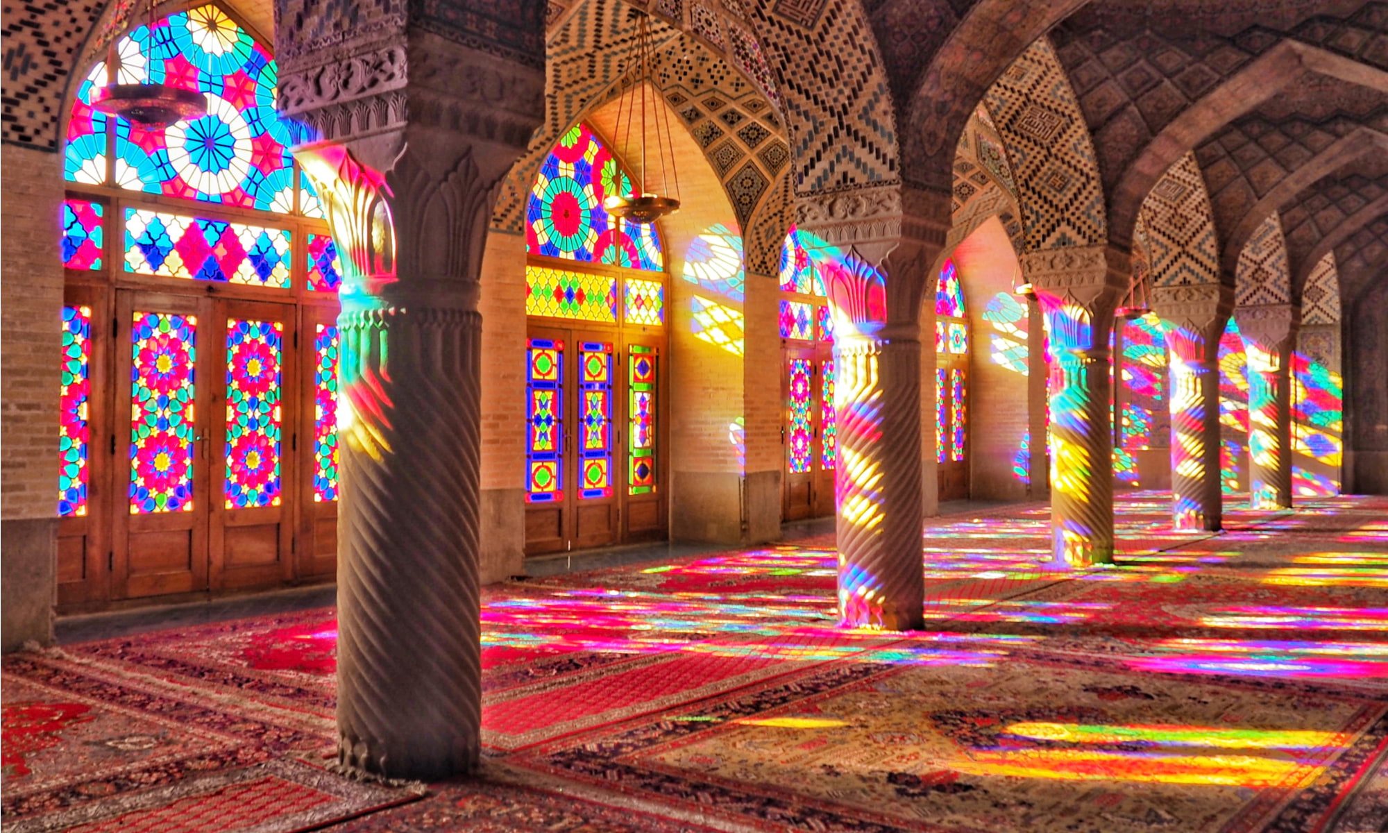 reflection of rainbow colors in a beautiful mosque in iran