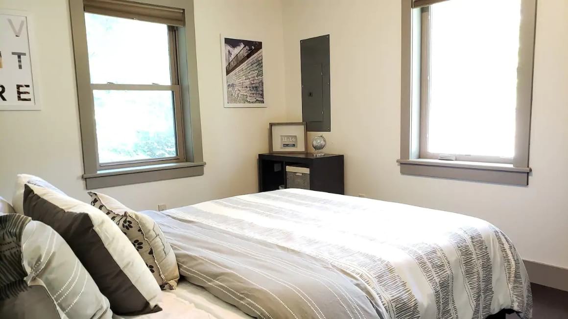Comfortable light bedroom at Chic Escape Lake George New York