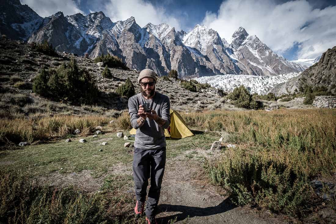 A backpacker in Pakistan taking a photo with an action cam