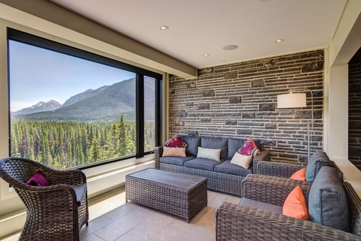 Downtown Views lounge with lovely couches and views out to the forests and mountains.
