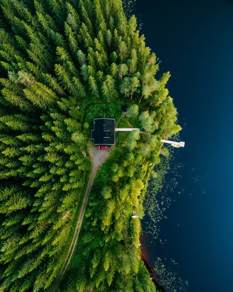 finland cabin in the woods next to lake