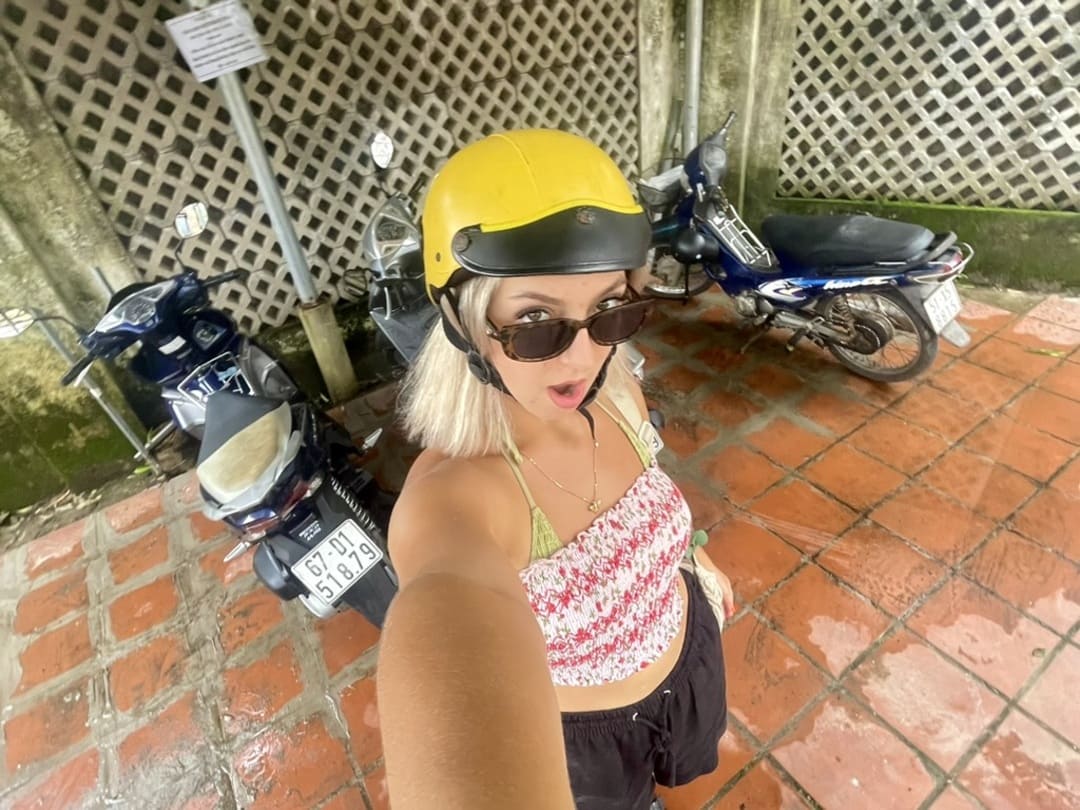taya posing with a helmet in phu quoc