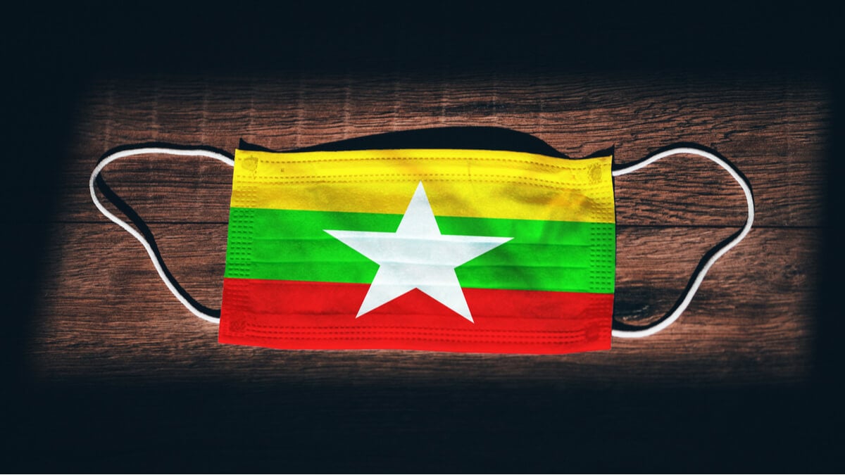A surgical mask for COVID protection with the Myanmar flag on it