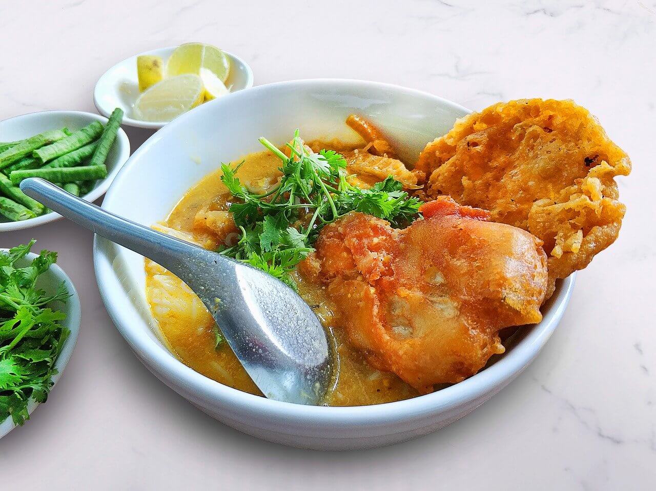 A mohinga soup with fried chicken - beloved national dish in Myanmar