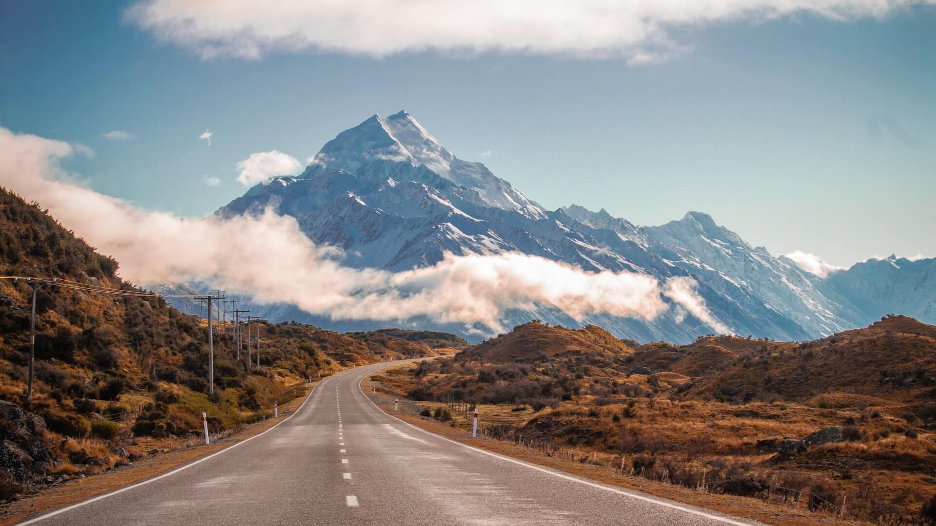 On a driving tour of New Zealand approaching Mount Cook by road