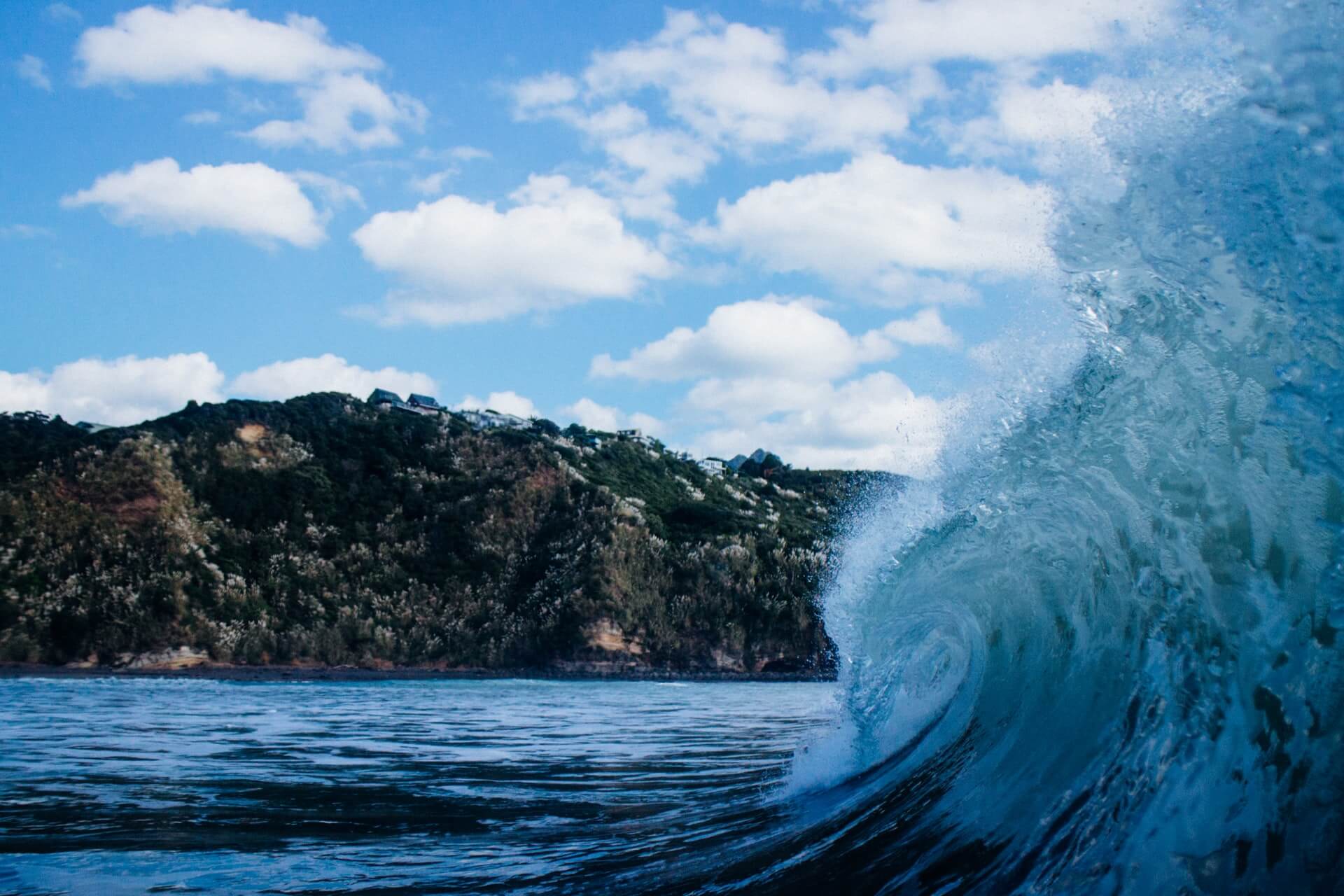 A peeling wave of the beach in Raglan, North Island