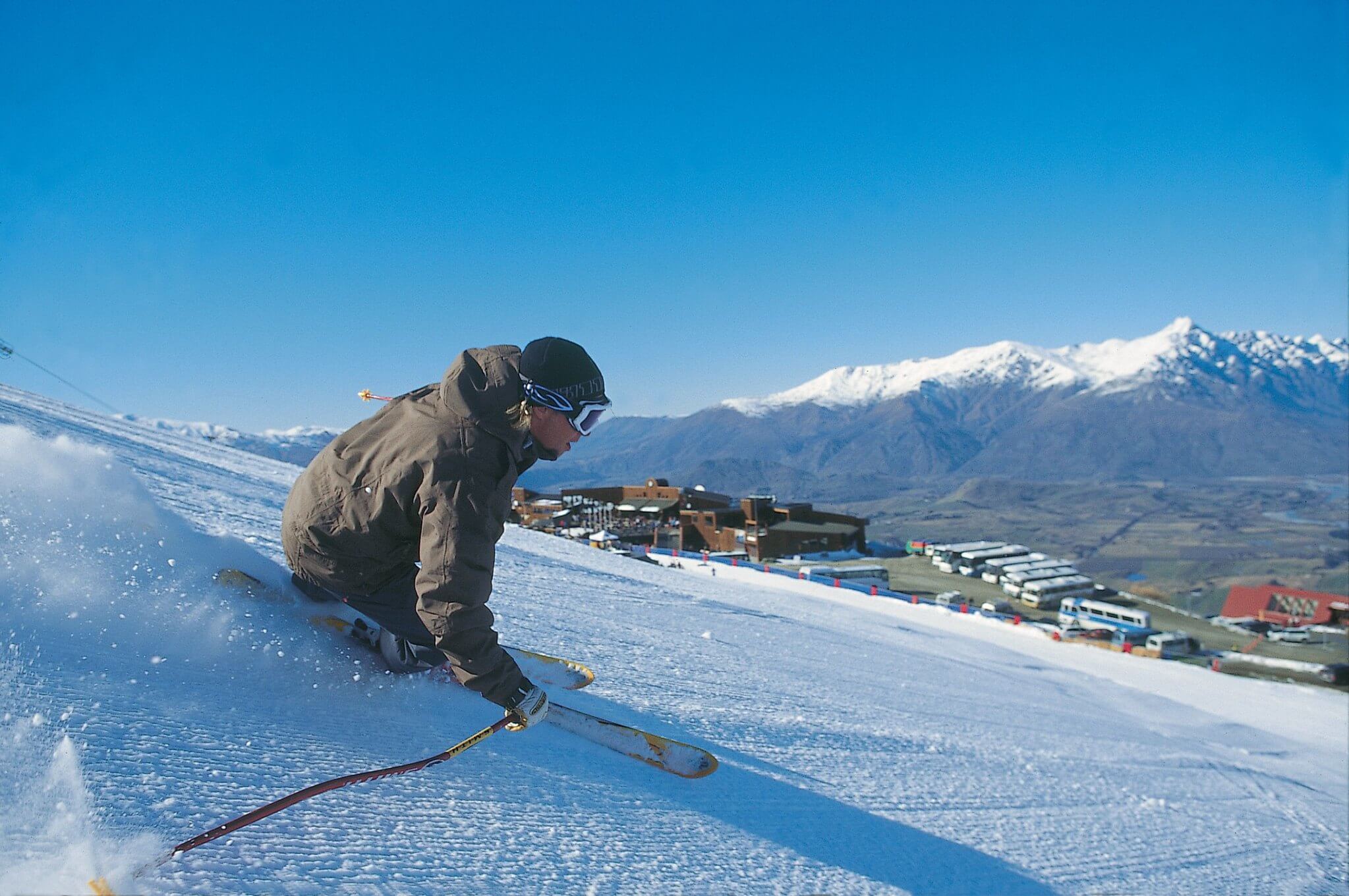 A man skiing at Coronet Peak ski field and resort - best place to visit in Queenstown in winter