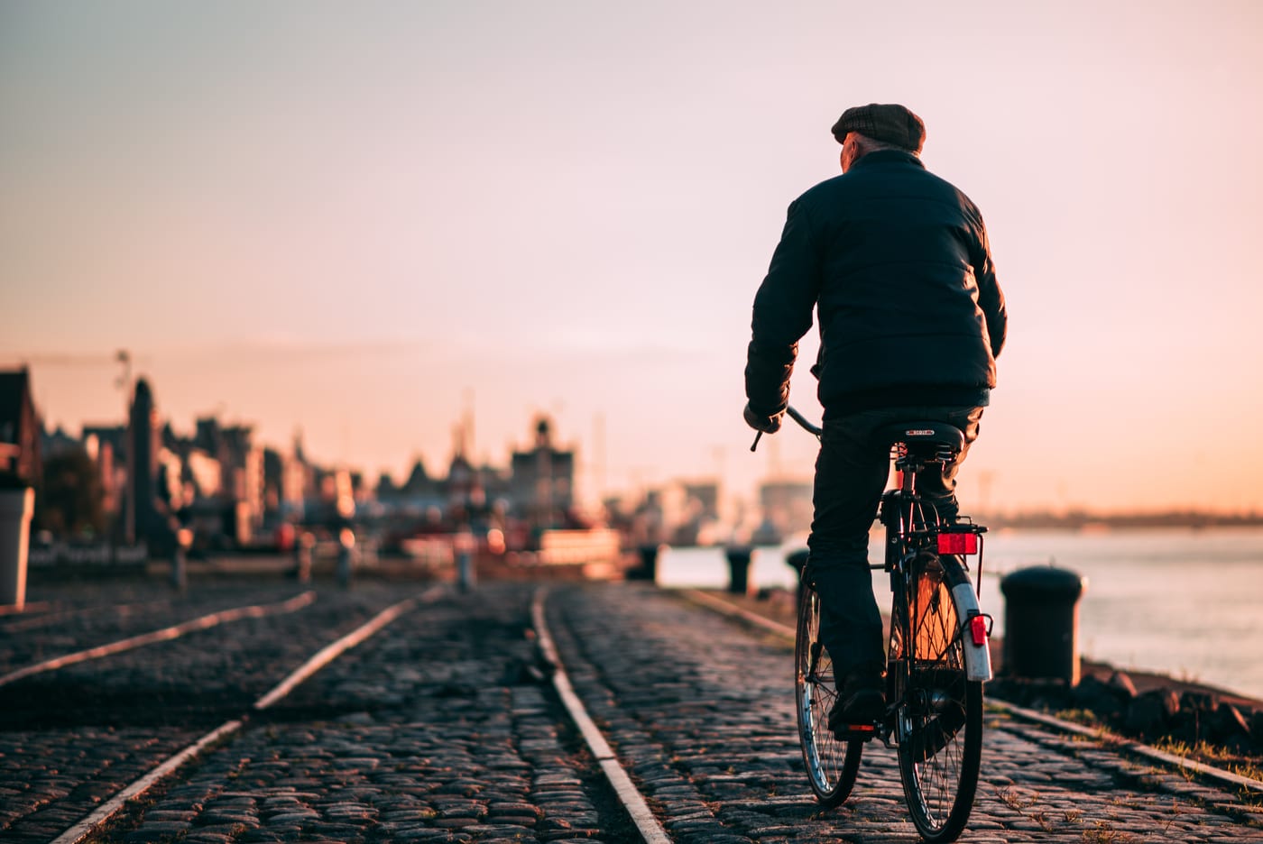 man riding bike in belgium travel guide