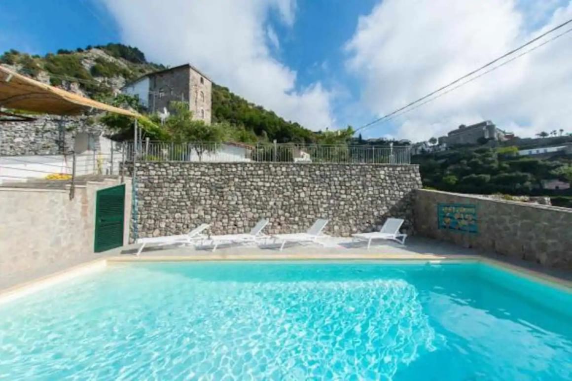 Pool area in the villa with loungers