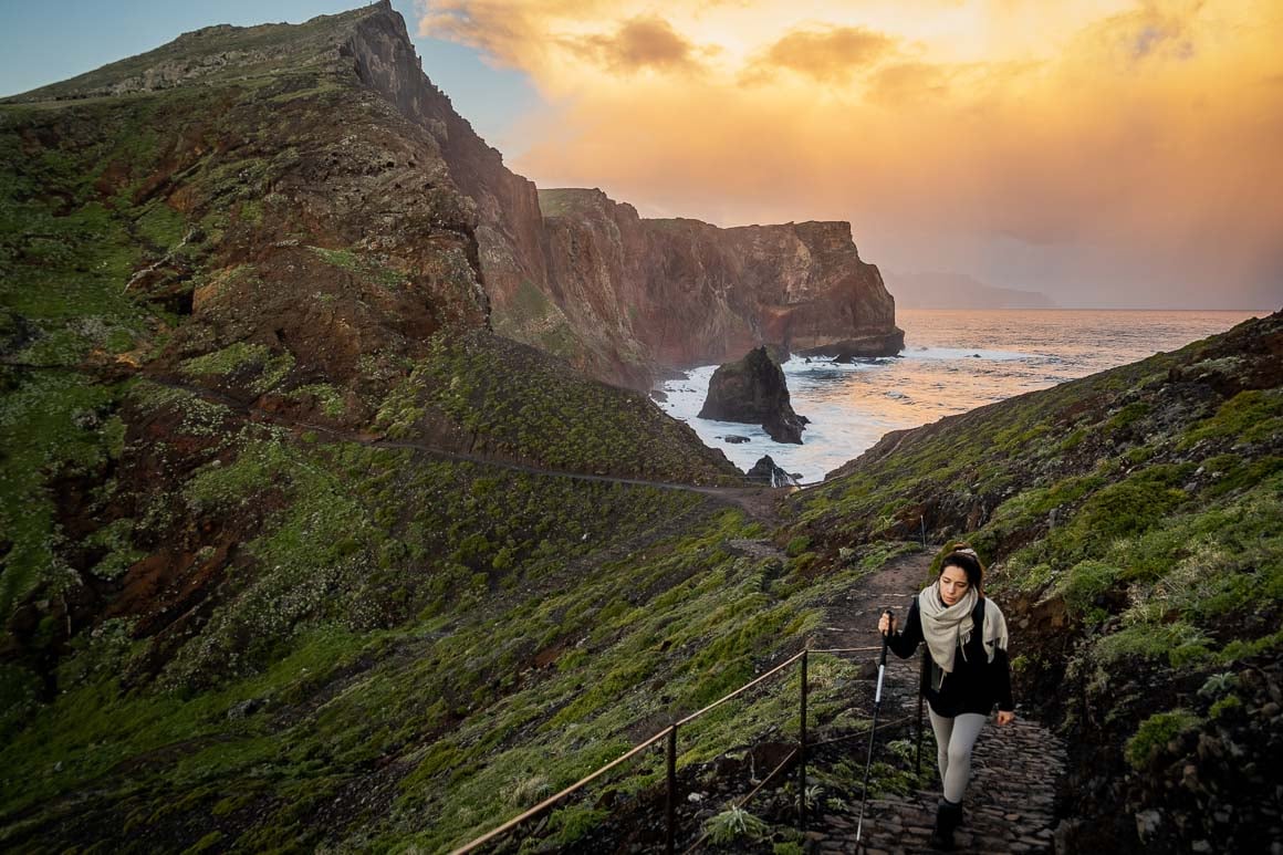 lady hiking san louerco hike madeira at sunset, portugal