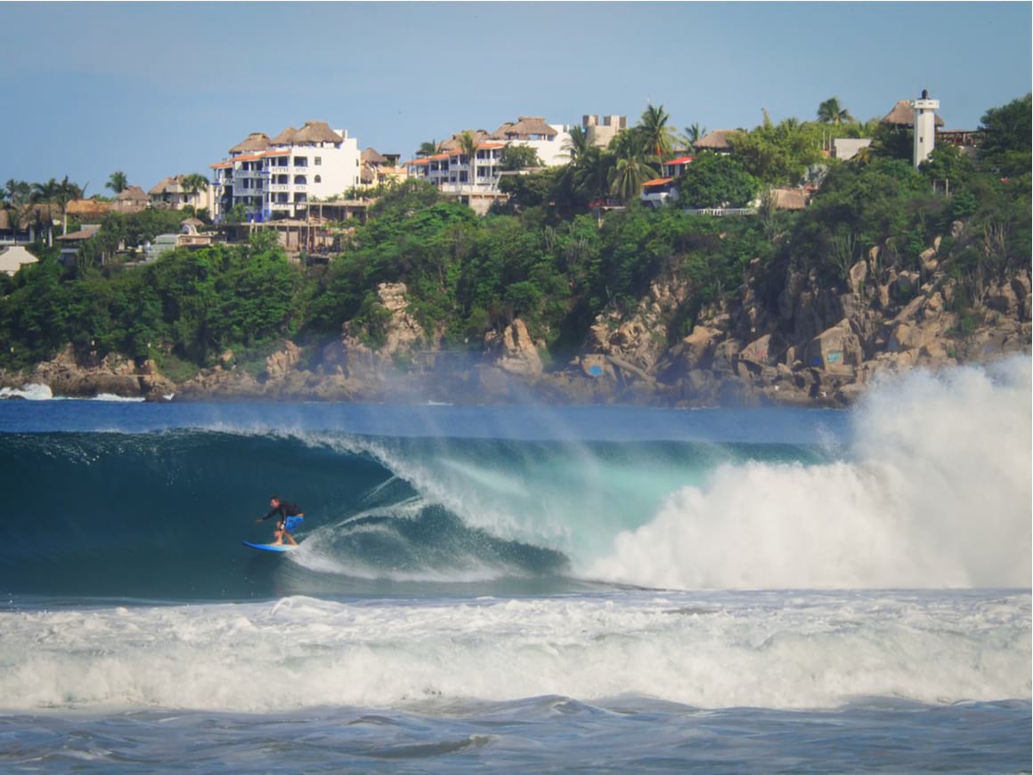 A man surfing in Puerto Escondido