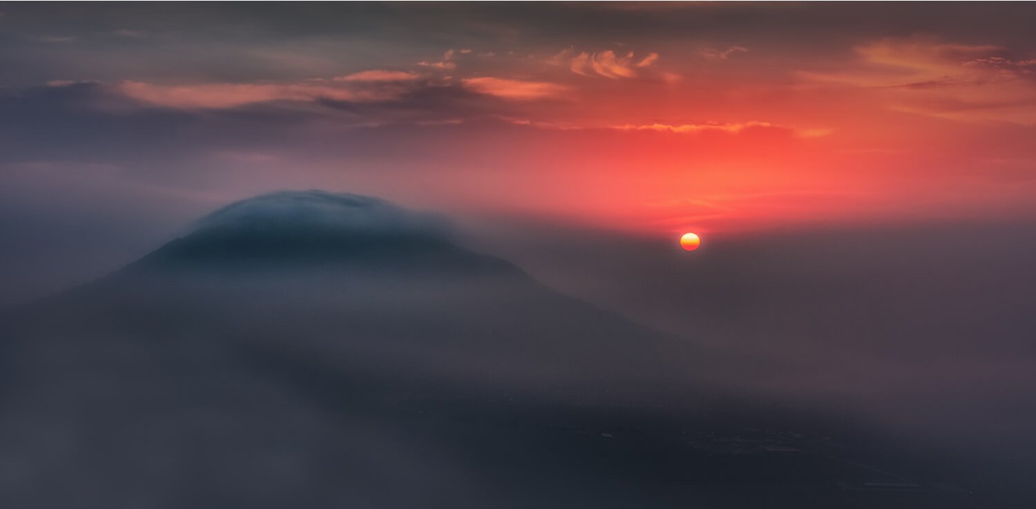 Mount Tabor - a famous religious place to visit in Israel - with a crimson red sunset