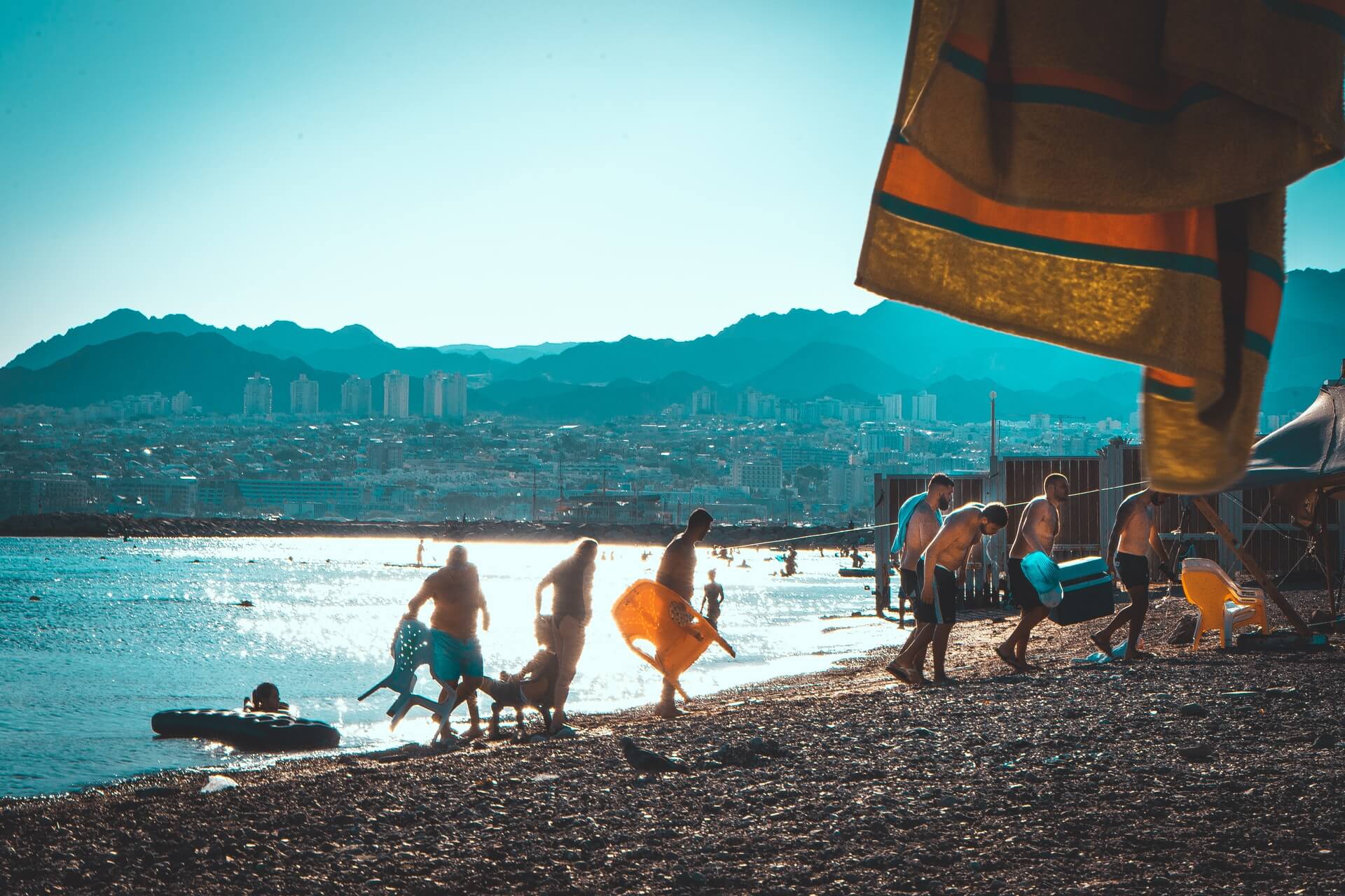 A crowd of tourists at a beach in Eilat