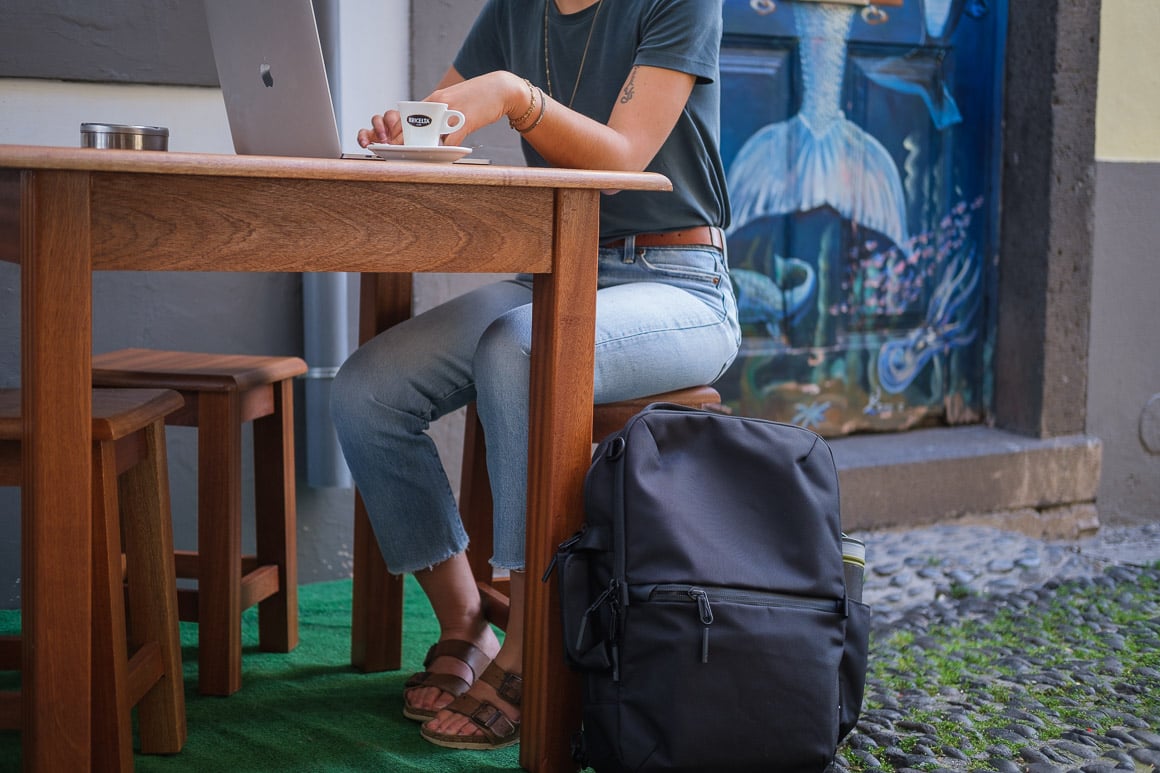 black backpack at cafe