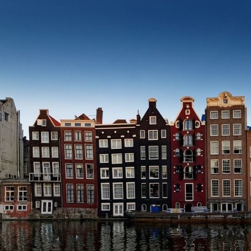Canal houses crammed in close together in Amsterdam