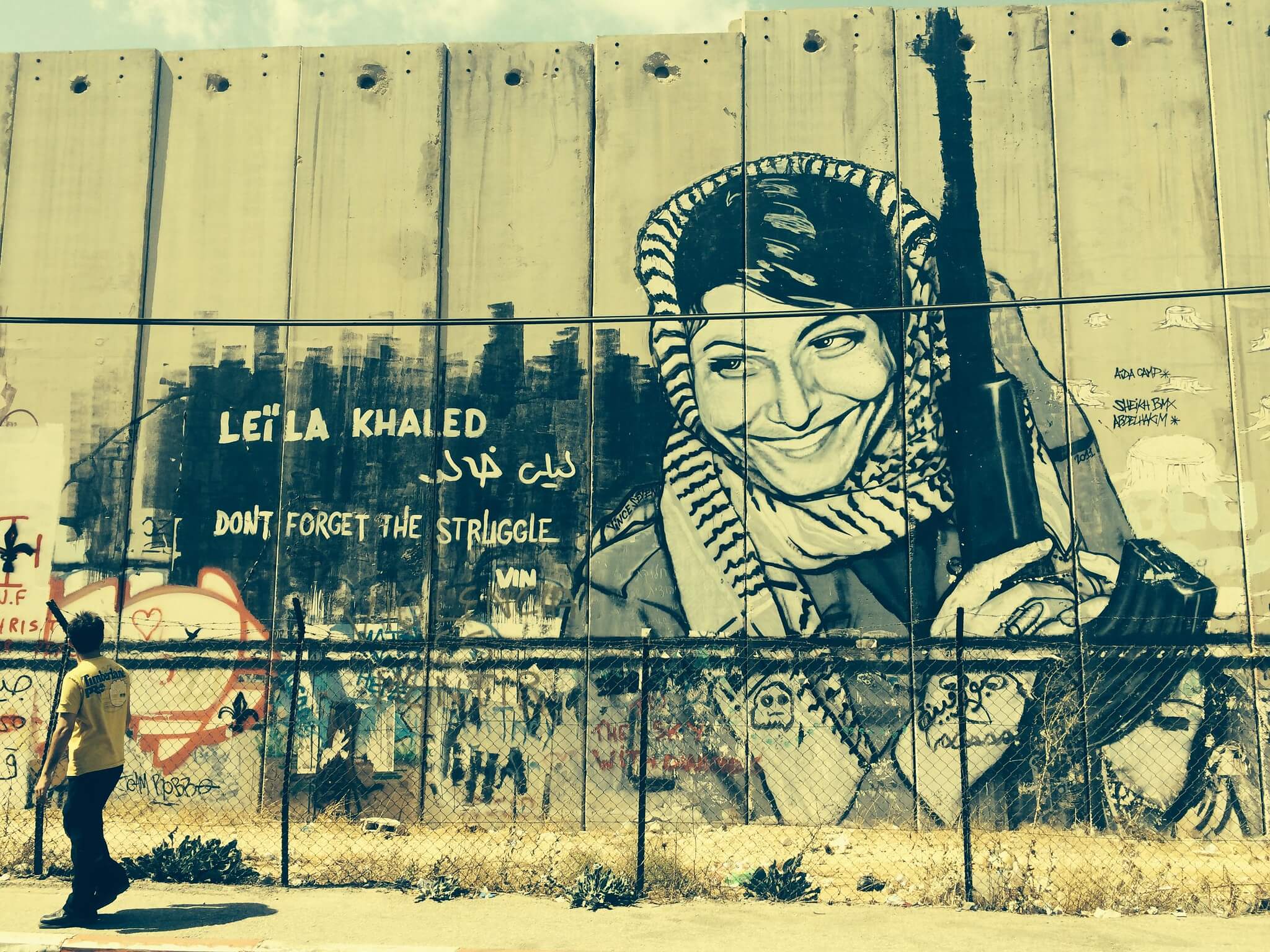 Street art mural of Leila Khaled on the Israeli West Bank barrier in Bethlehem