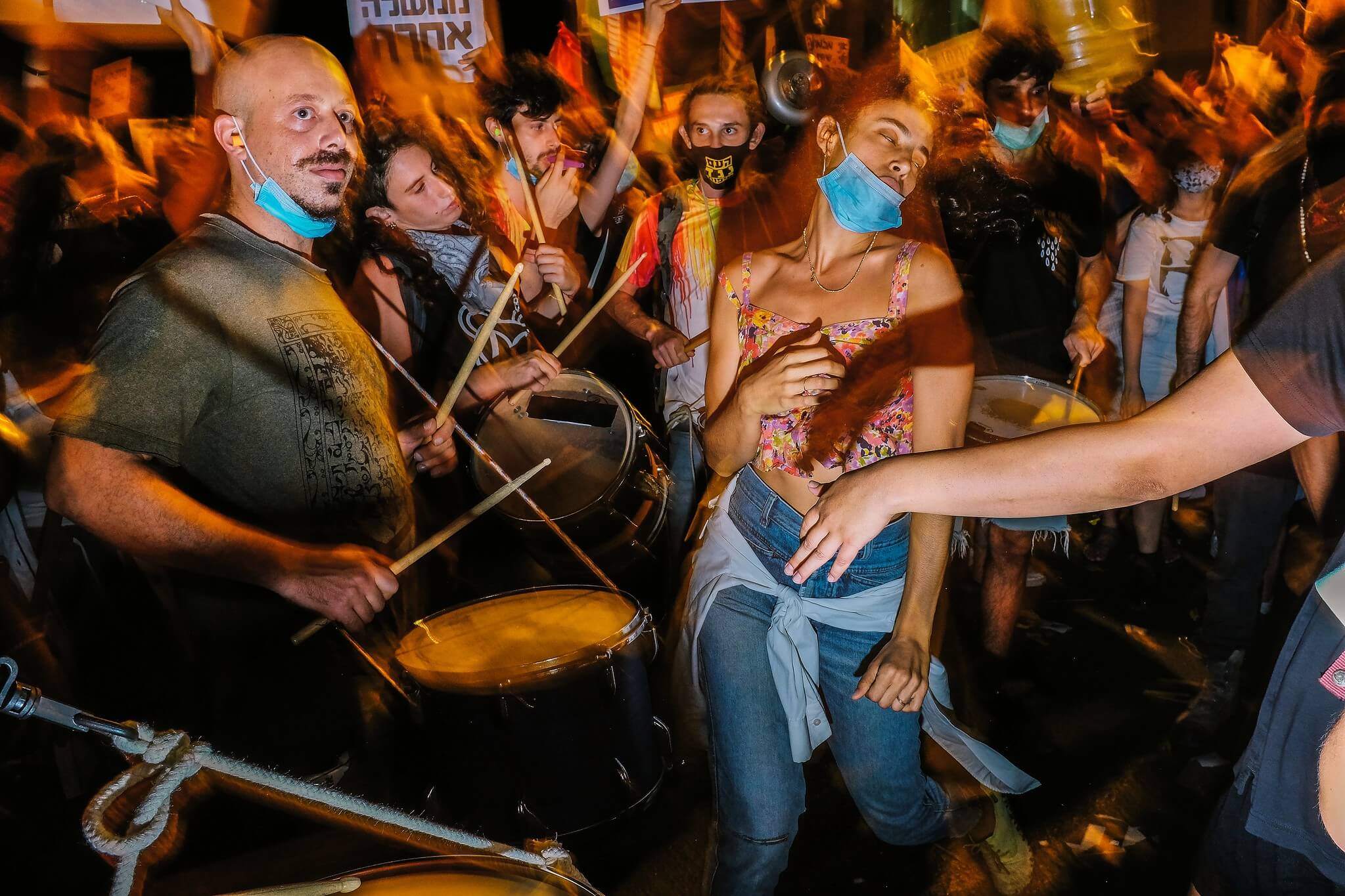 Protesters at a political demonstration in Jersualem dance the blues away