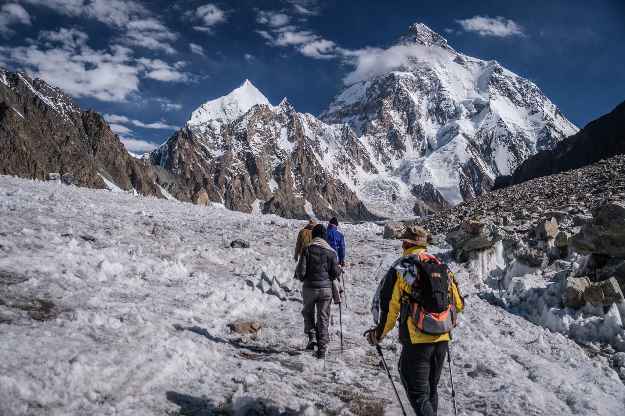 trekkers doing the k2 trek amongst the mountains of northern pakistan