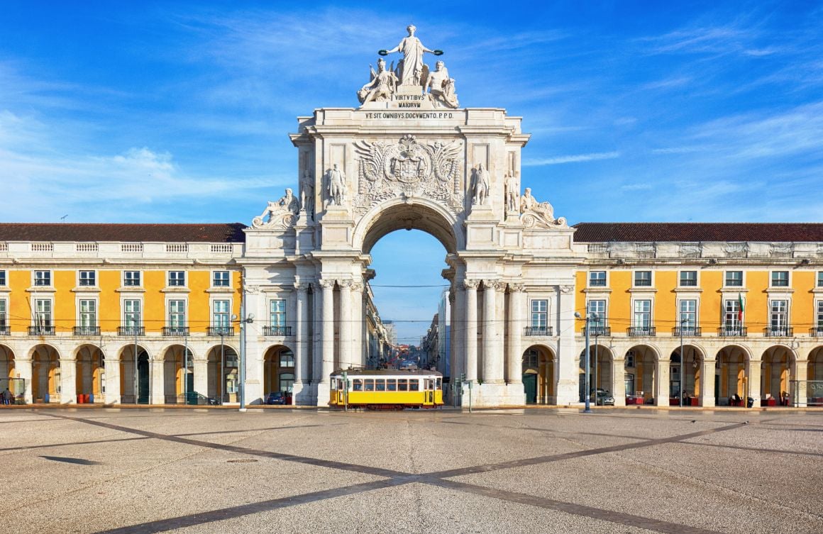 Yellow tram in Praça do Comércio, Lisbon 