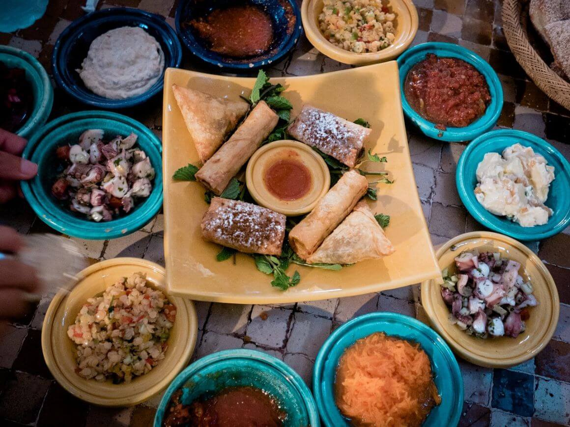 A table full of many types of food that you could recreate in a sailboat galley