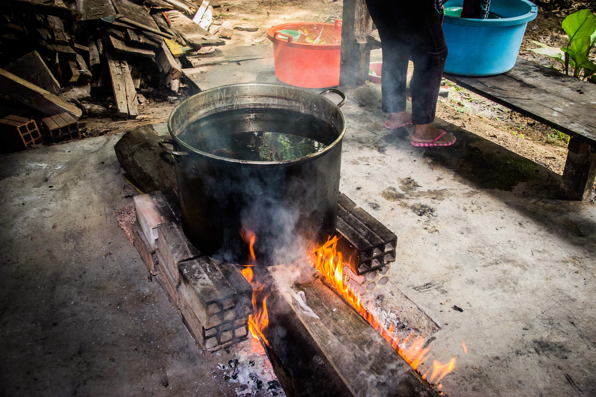 Drug Tourism in South America - Ayahuasca being brewed in a pot over a fire