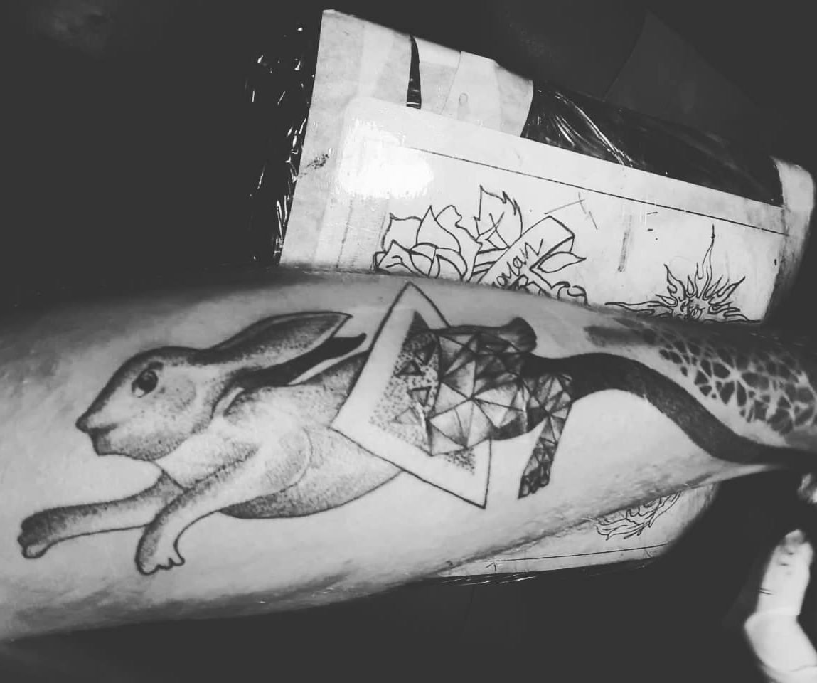 travel tattoo of a rabbit