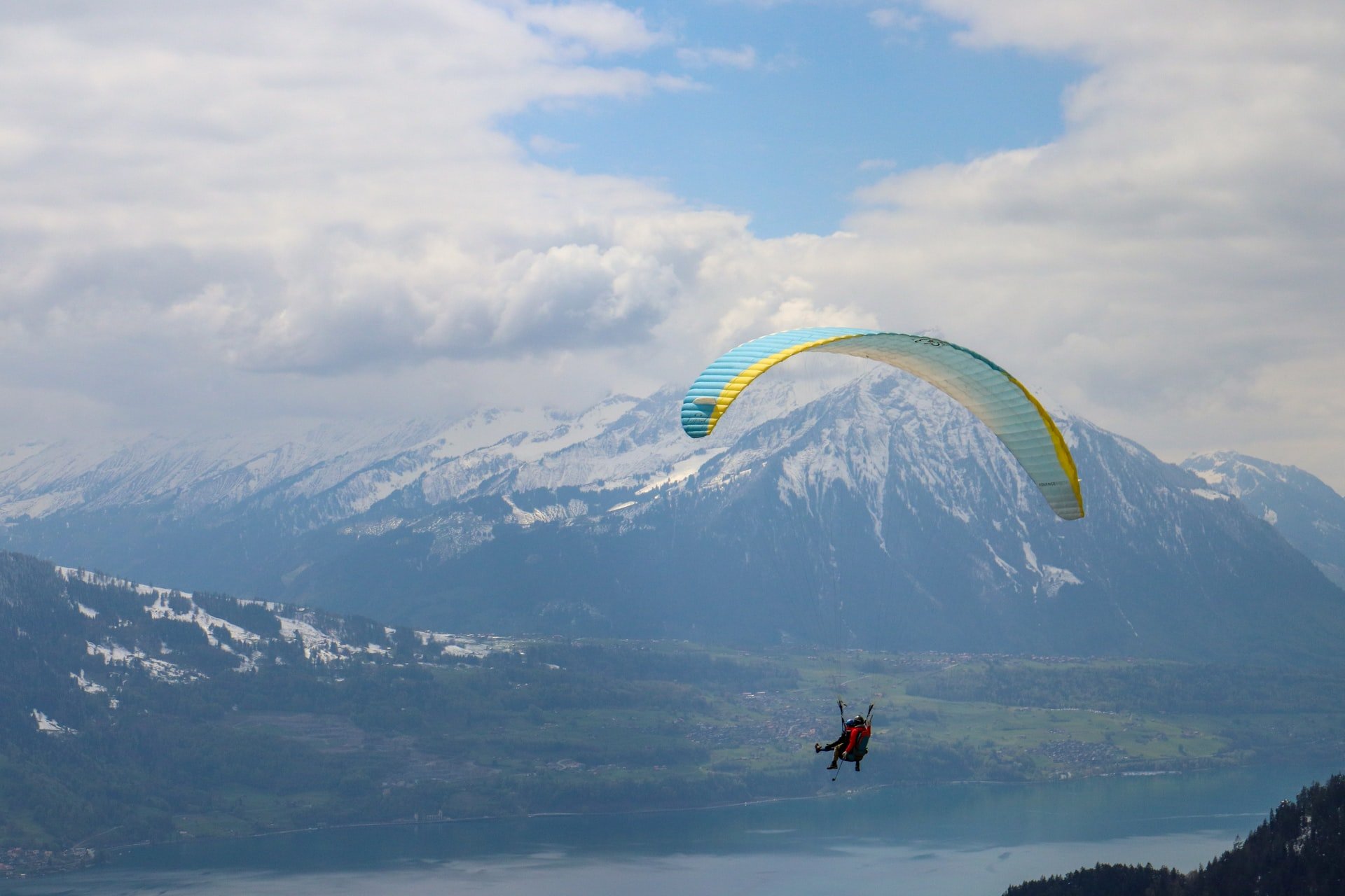 paragliding in mountains of interlaken switzerland