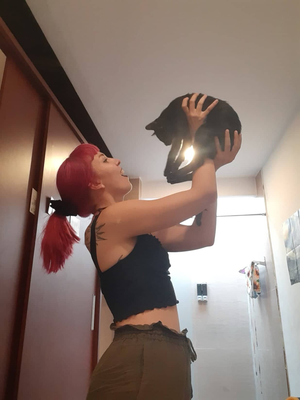 a digital nomad holding her cat