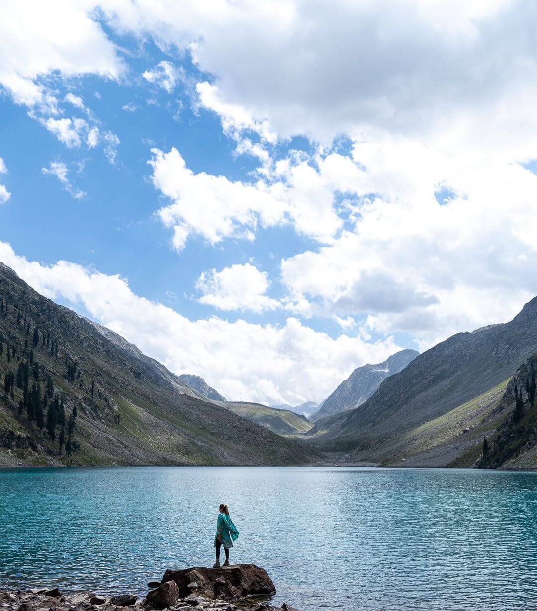 Samantha standing at a gorgeous laske in Pakistan