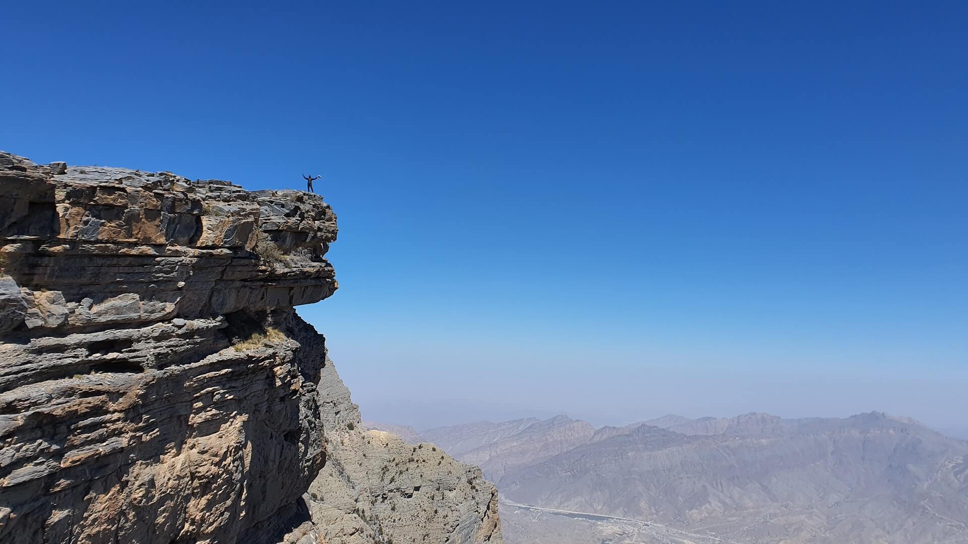 blue sky view over jebel shams lookout while backpacking in oman
