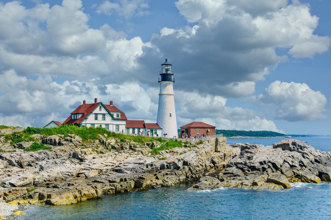 View of lighthouse and rocky seaside at Cape Elizabeth in Portland Maine