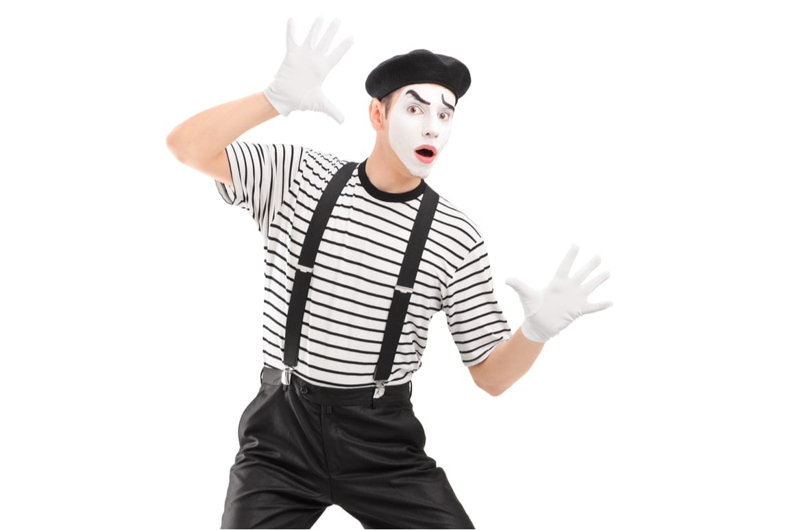 A mime presses against the screen. 