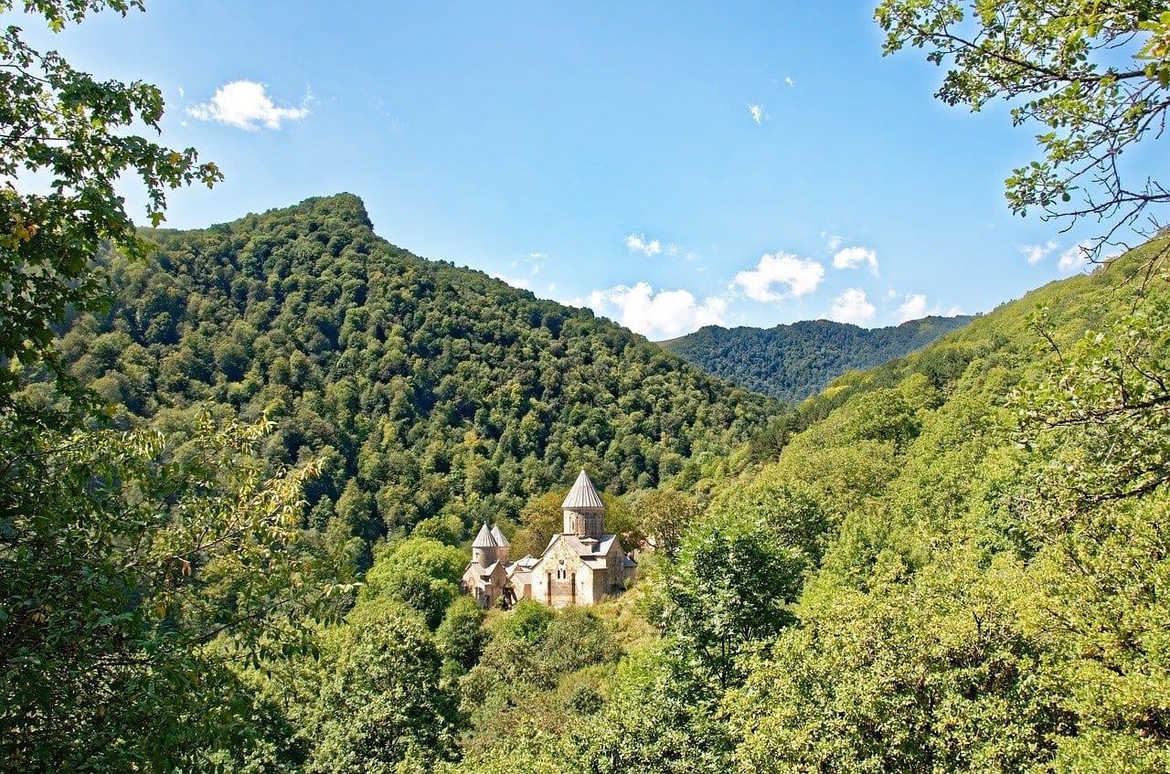 monastery from far away in the forest