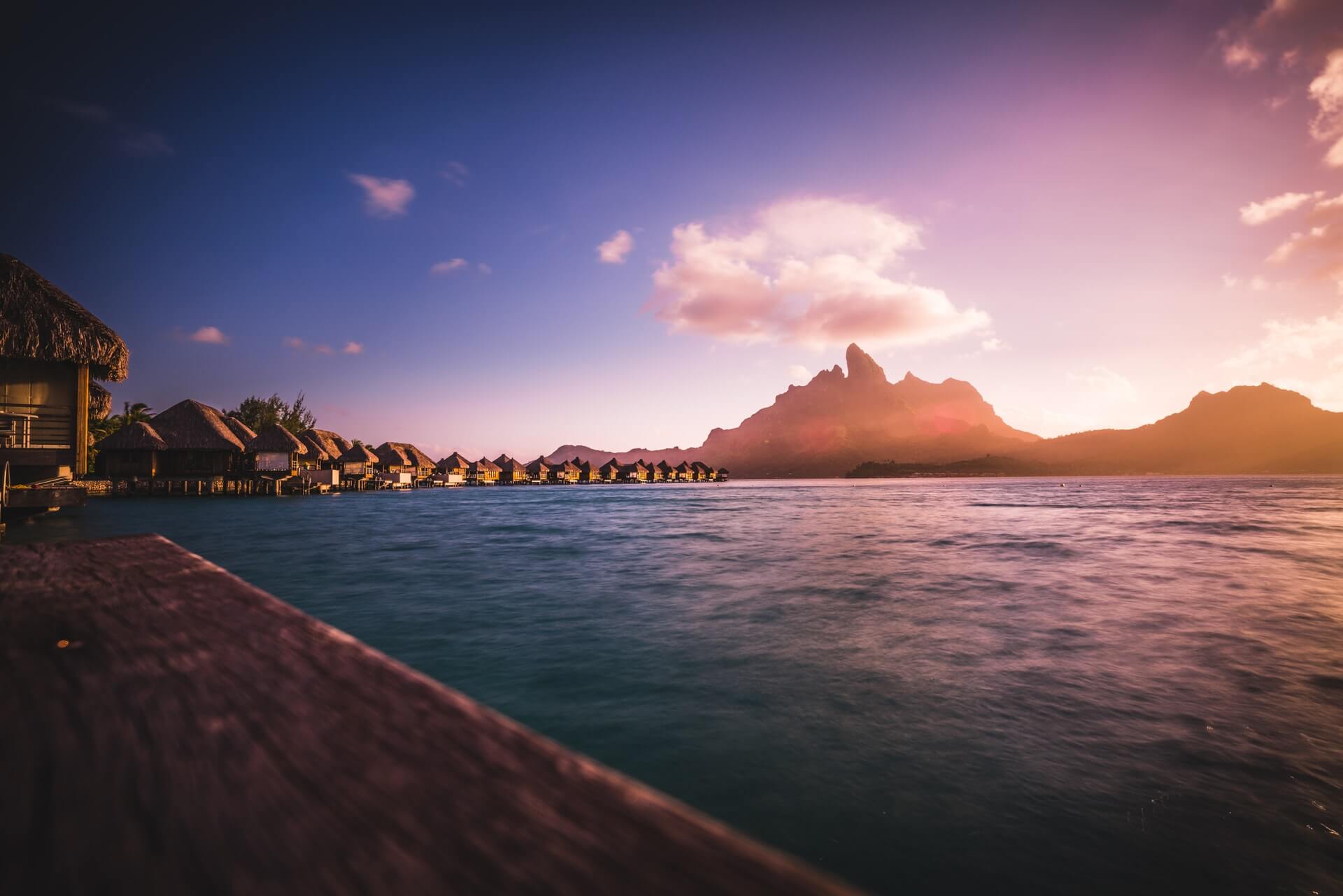 A glowing sunset at an atoll in French Polynesia.