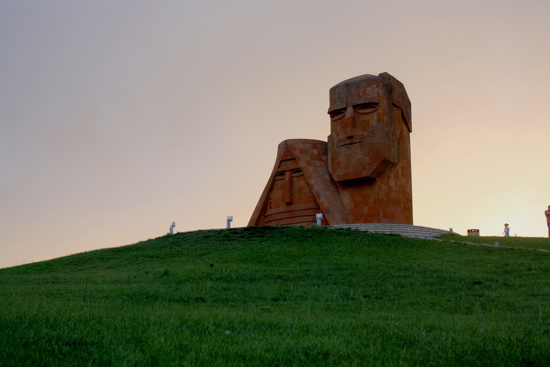 monument with two statues on top of hill