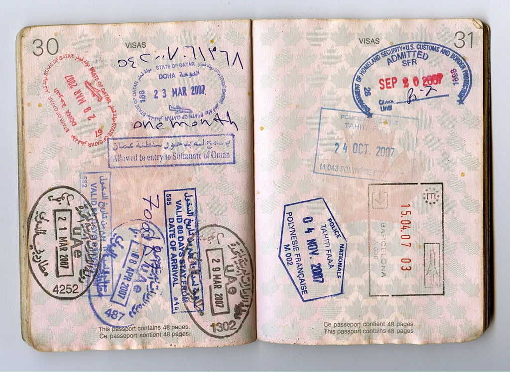 A photograph of a passport showing enterance stamps. 