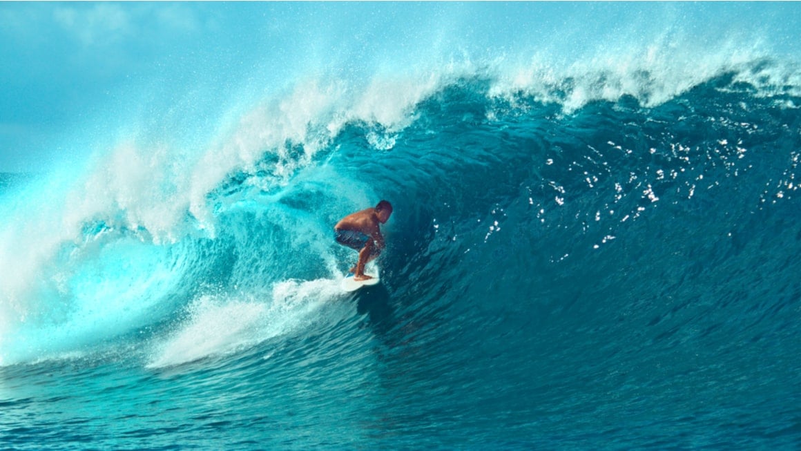 A surfer in the tube in French Polynesia