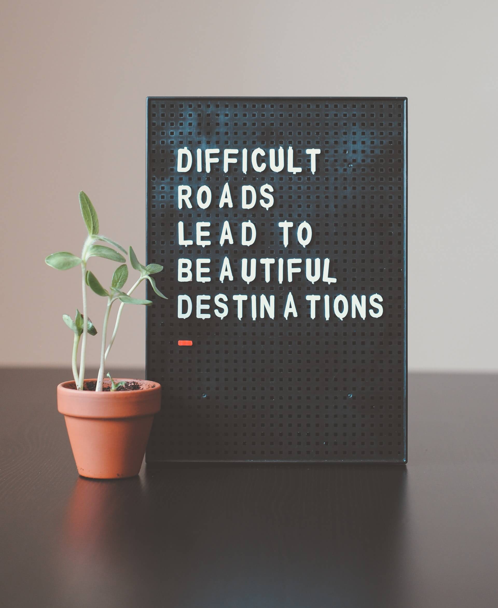 "Difficult roads lead to beautiful destinations" - inspiring quote for travellers
