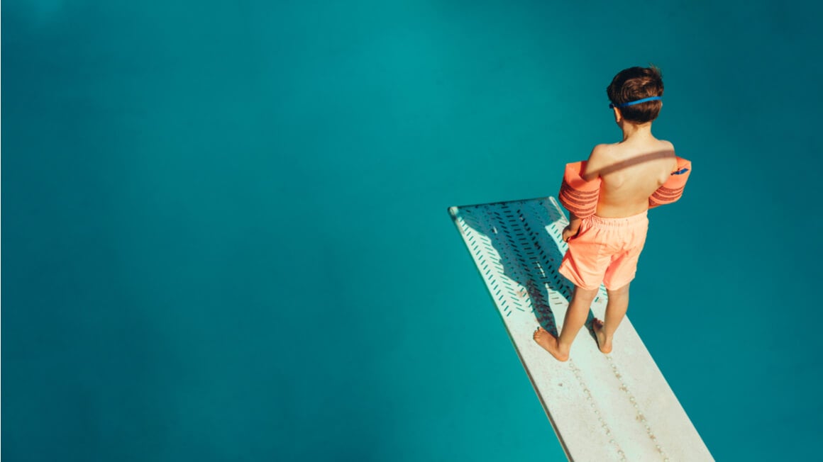 A boy on a plank respresenting the dive after getting a TEFL certificate.