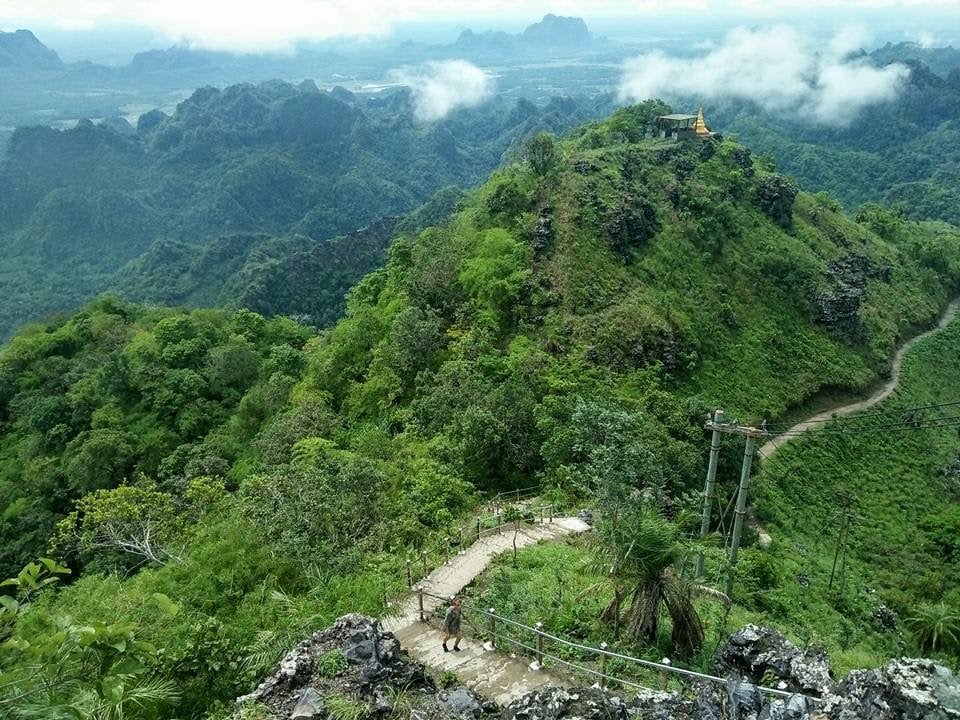 A small golden temple on a large jungle mountains in Myanmar. 