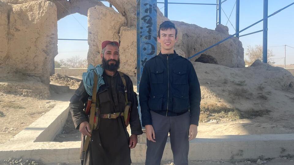 TBB team member Alex alongside a Taliban bodyguard in Balkh, Afghanistan.
