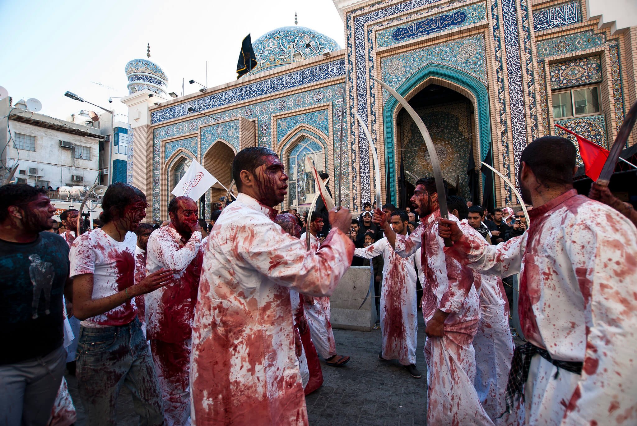 A live demonstration of ritualistic self-flagellation during an Ashura festival.