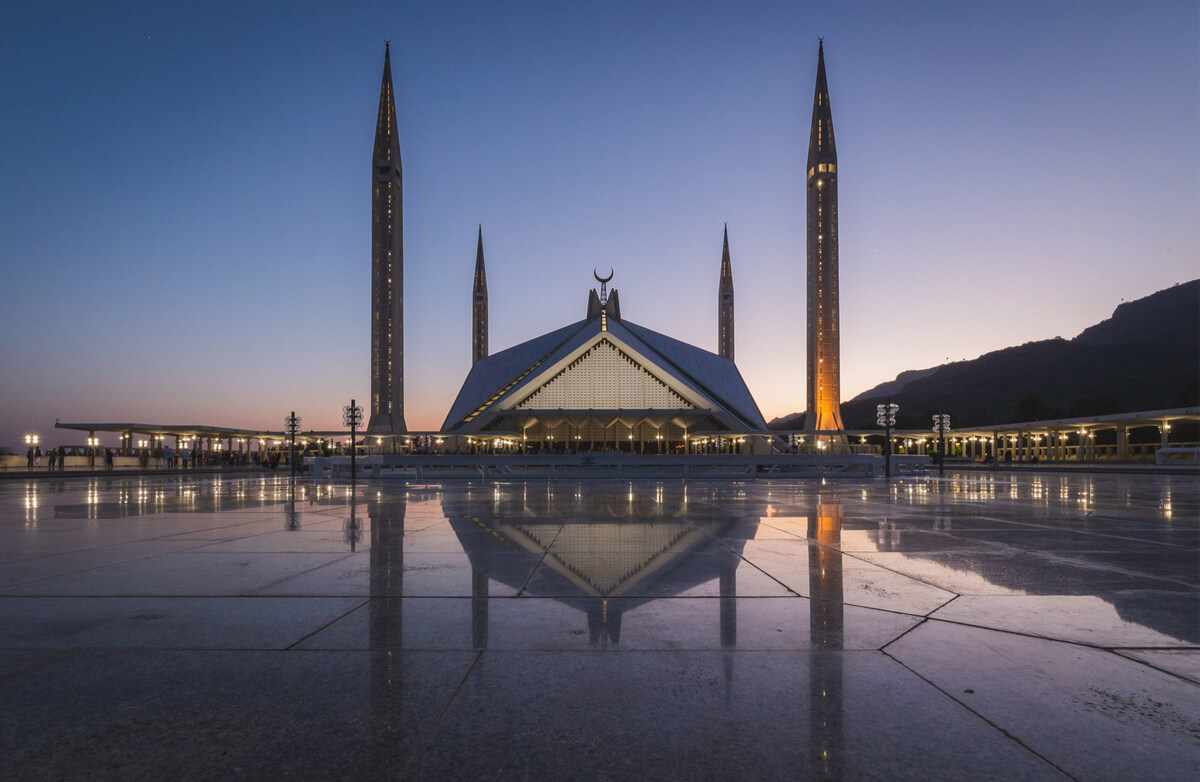 faisal mosque in pakistan during purple sunset